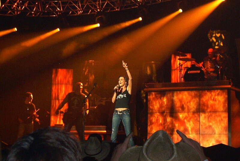 Woman Singing on Stage — Orange