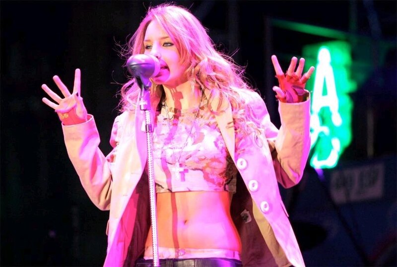 Woman Singing on Stage — Pink, Energetic, Night, Photograph, Microphone, Neon Sign