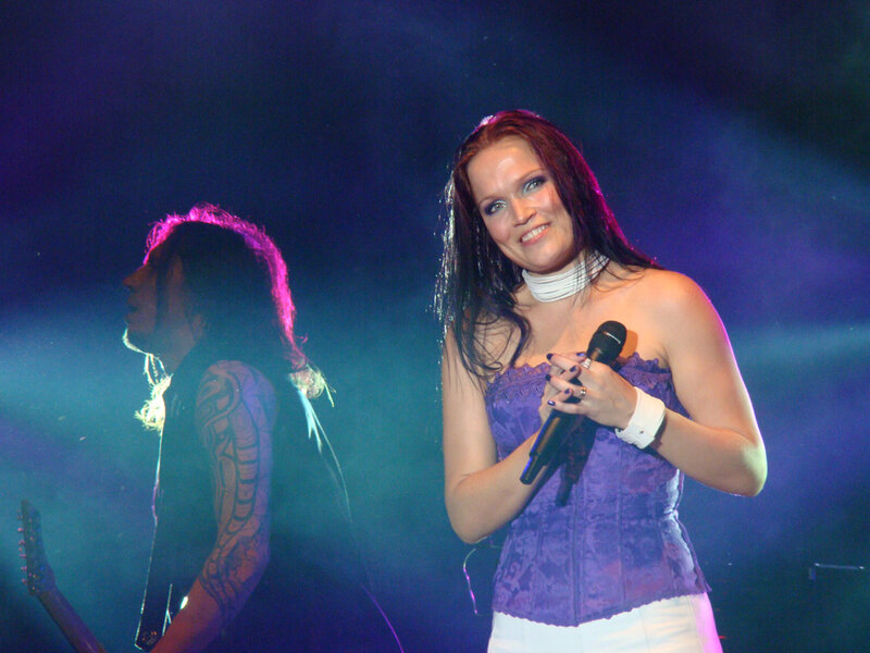 Woman Singing on Stage — Purple, Dramatic, Night, Photograph, Man with Guitar