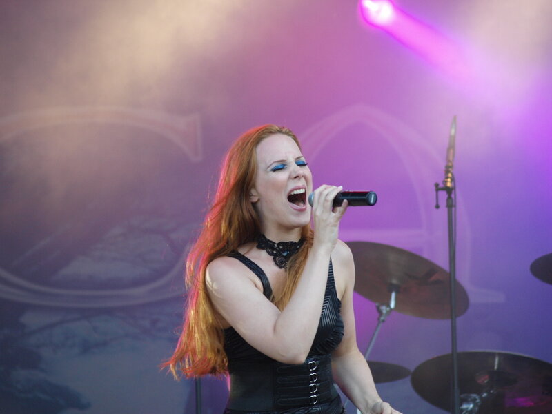 Woman Singing on Stage — Purple, Dramatic