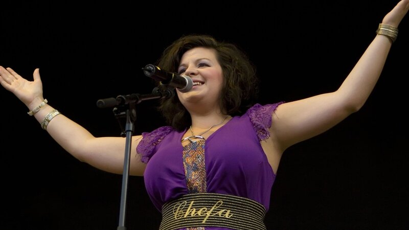 Woman Singing on Stage — Purple, Energetic, Photograph