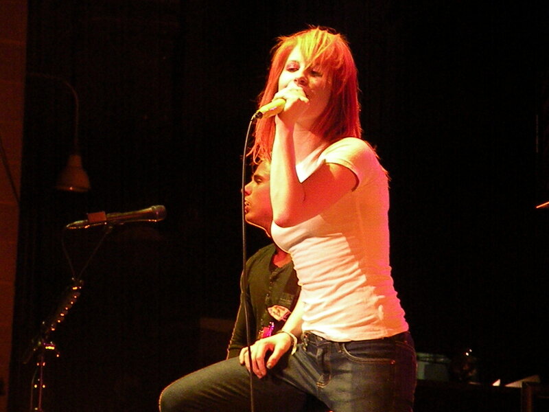 Woman Singing on Stage — Red, Dramatic, Night, Photograph, Microphone, Man