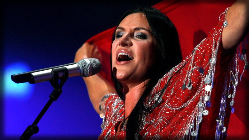 Woman Singing on Stage — Red, Dramatic, Night, Photograph, Microphone