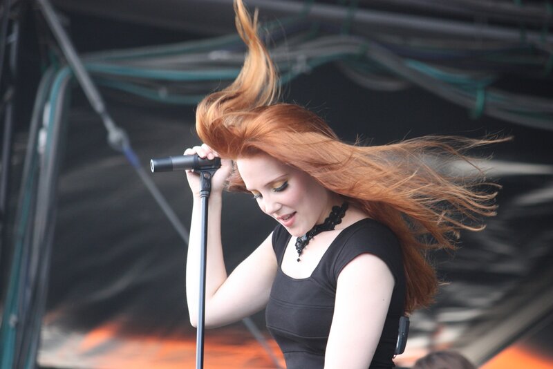 Woman Singing on Stage — Red, Energetic, Afternoon, Photograph