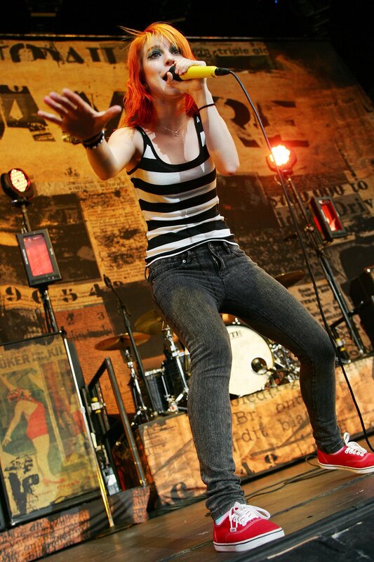 Woman Singing on Stage — Red, Energetic, Night, Photograph, Microphone, Drum Kit