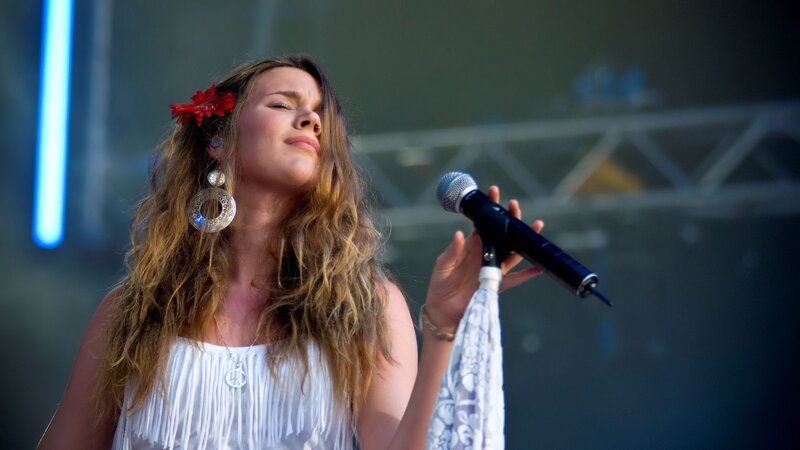 Woman Singing on Stage — White, Focused