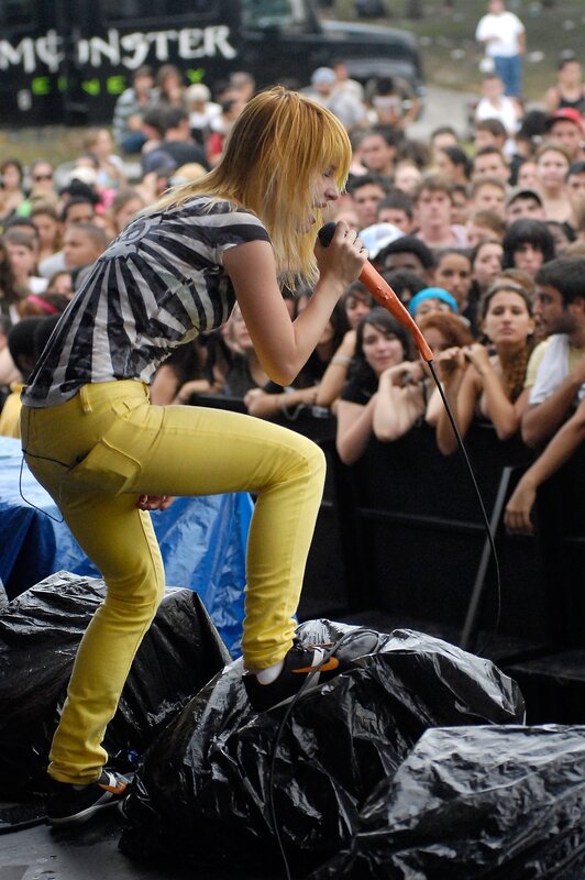 Woman Singing on Stage — Yellow, Energetic, Afternoon, Photograph, Crowd