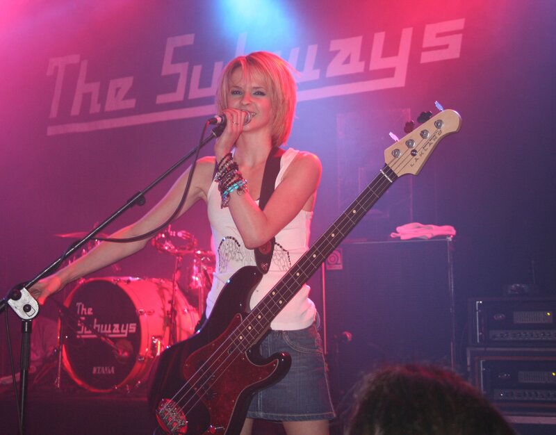 Woman singing with bass guitar