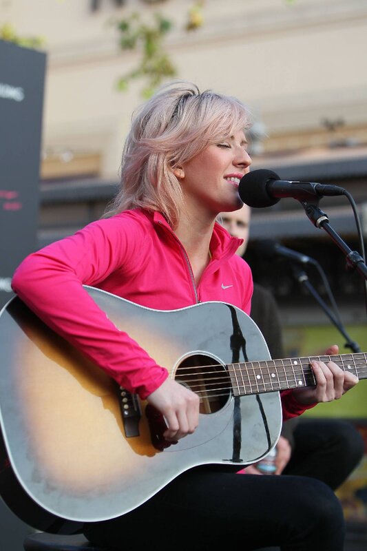 Woman singing with guitar