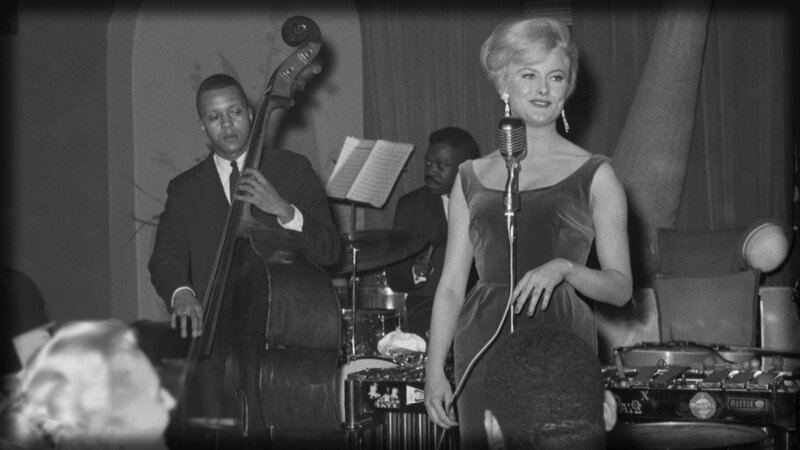 Woman singing with jazz band