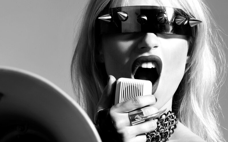 woman singing with spiked headband
