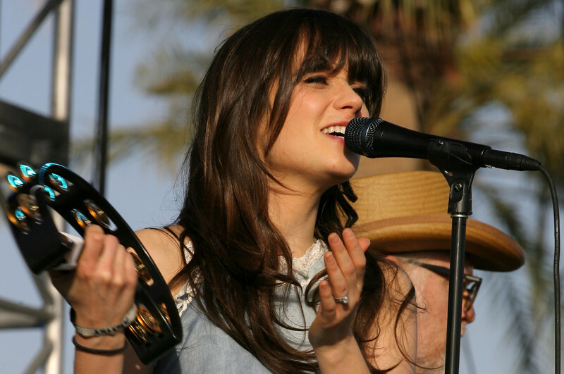 woman singing with tambourine