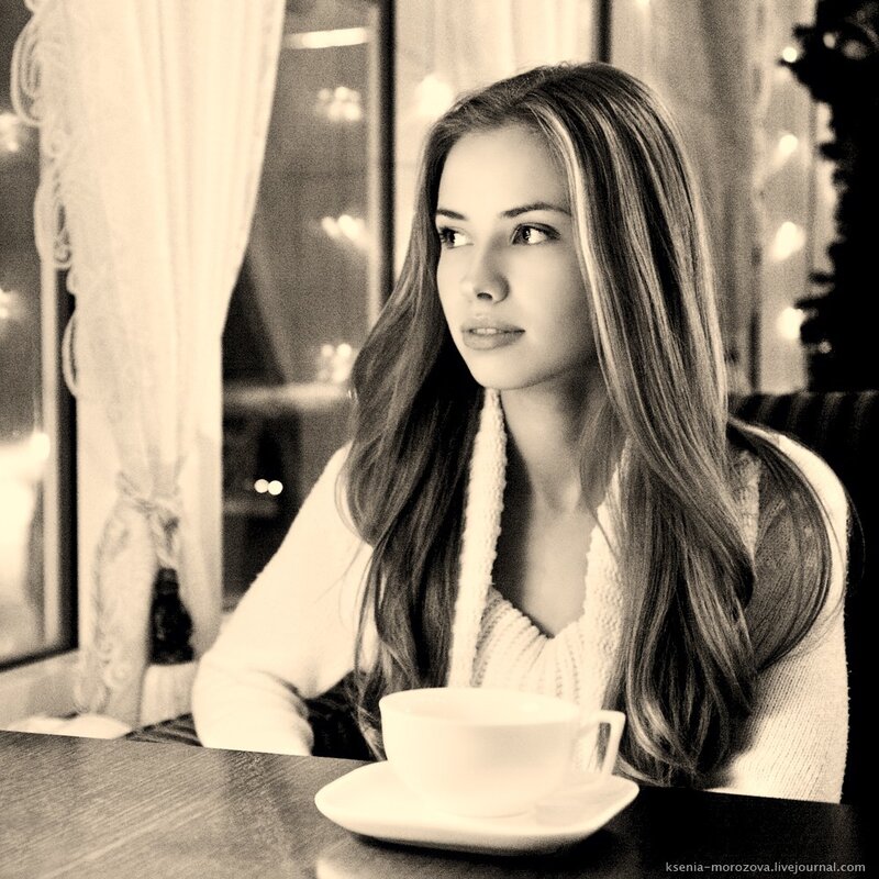 woman sitting at a cafe