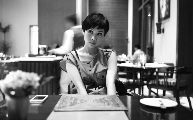woman sitting at a restaurant table