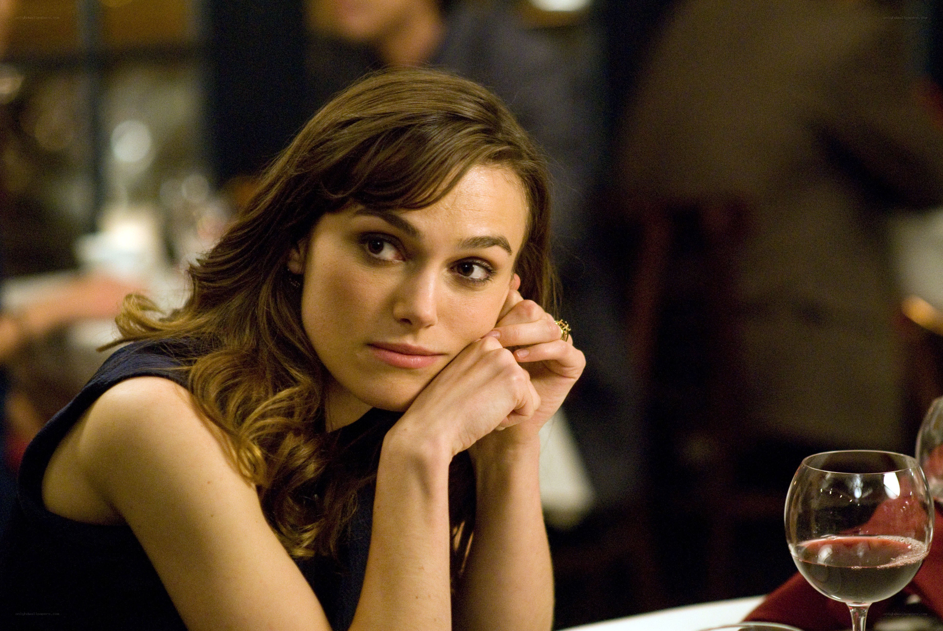 woman sitting at a restaurant table