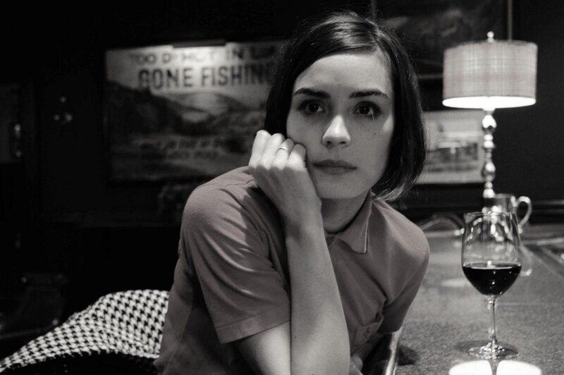 Woman Sitting at Bar — Black