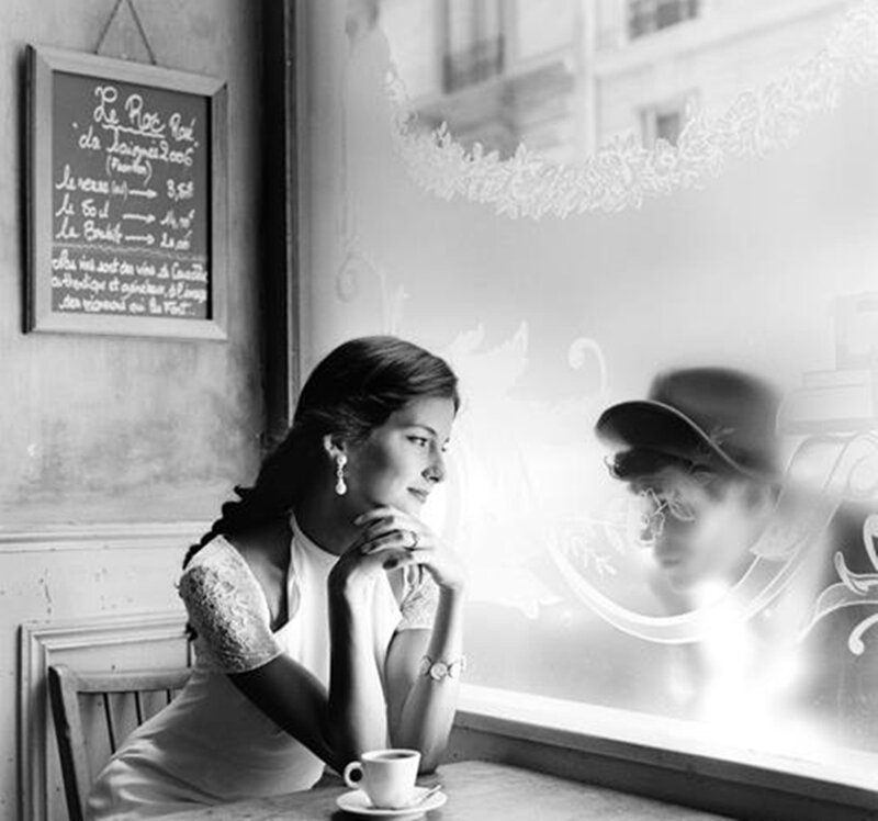 Woman Sitting at Cafe Table — Black
