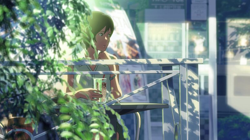 Woman Sitting at Cafe Table — Green