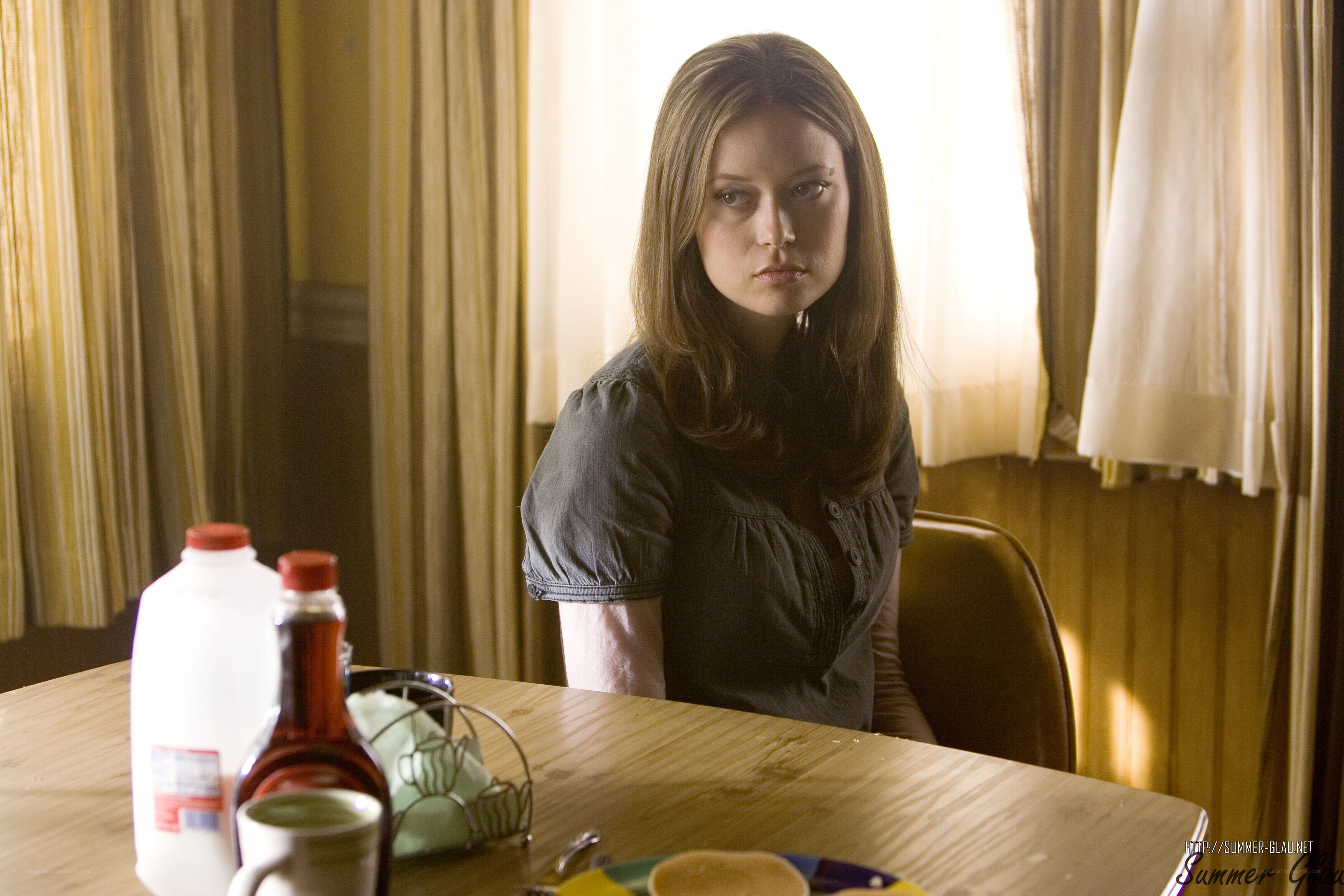 woman sitting at kitchen table
