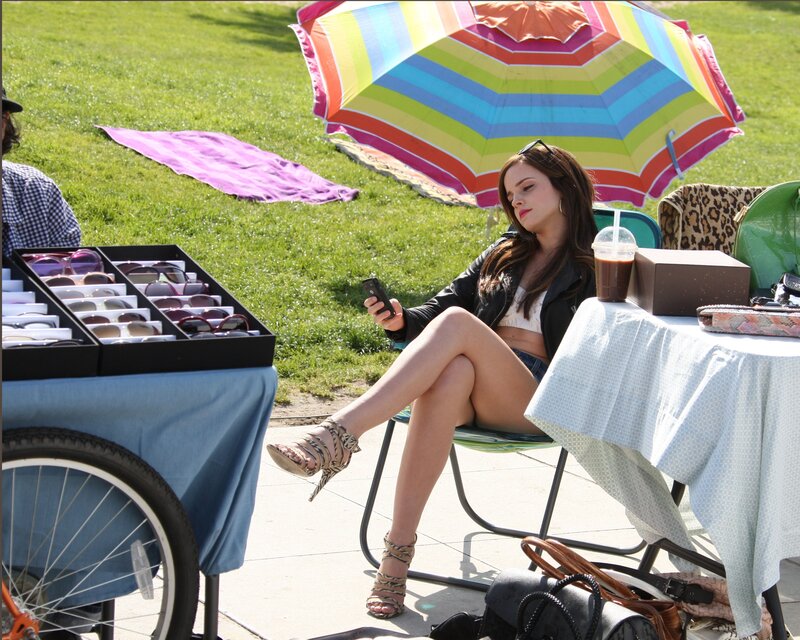 Woman Sitting at Outdoor Stall