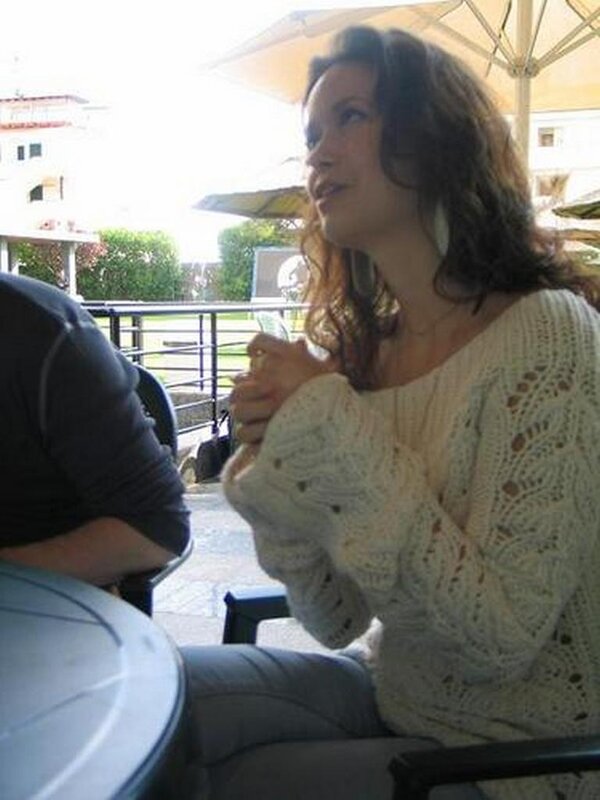 woman sitting at outdoor table