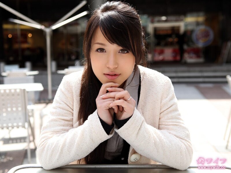 woman sitting at outdoor table