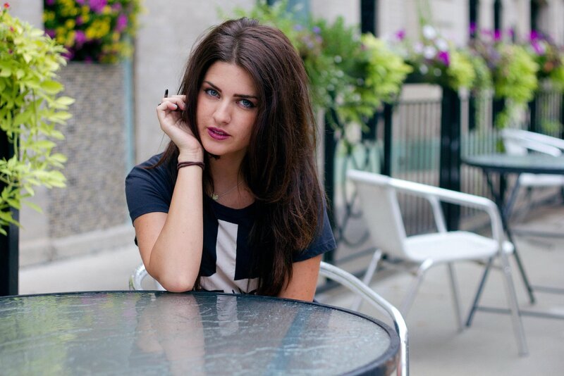 woman sitting at outdoor table
