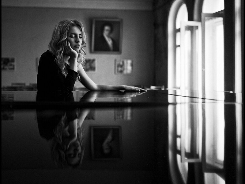 Woman Sitting at Piano — Black