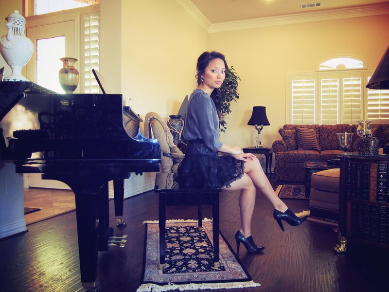 Woman Sitting at Piano