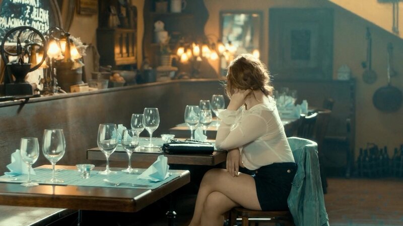 Woman Sitting at Restaurant Table