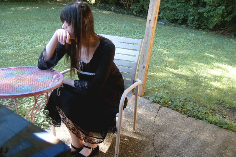 Woman Sitting at Table — Black, Calm, Afternoon
