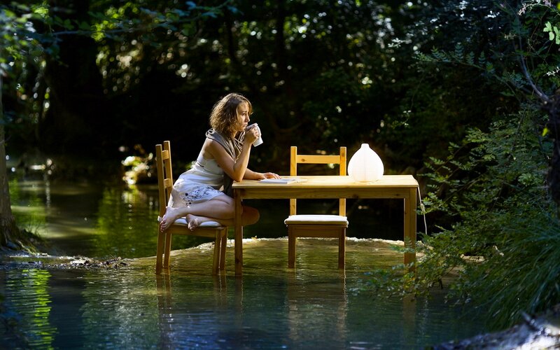 Woman Sitting at Table — Green