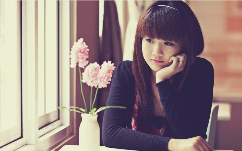 Woman Sitting at Table — Pink