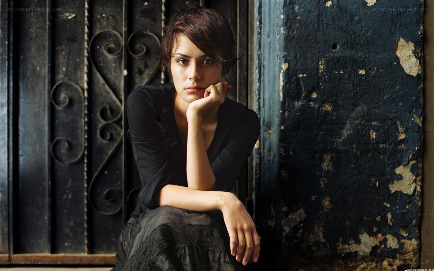woman sitting by a door