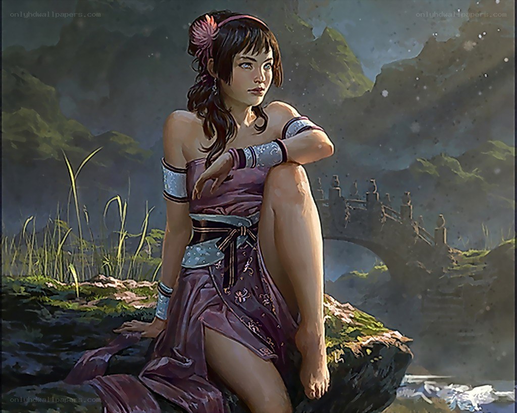 woman sitting by a river