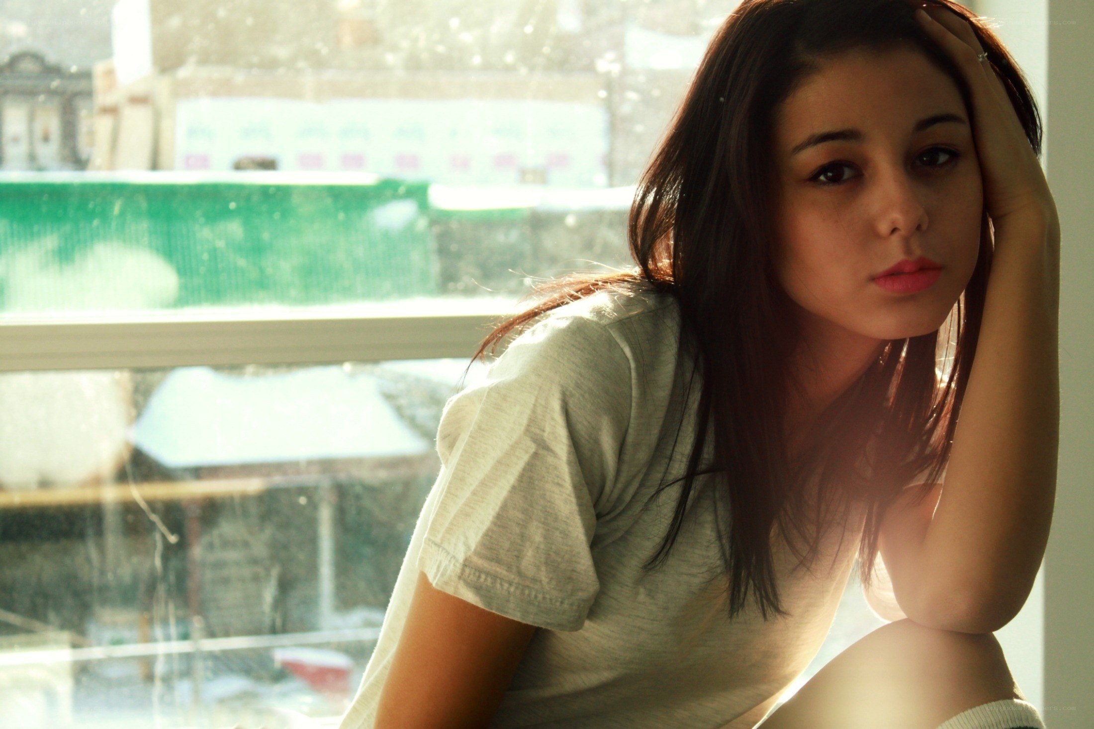 woman sitting by a window
