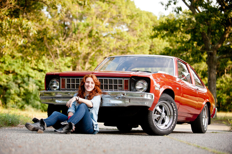Woman Sitting by Car — Red, Relaxed