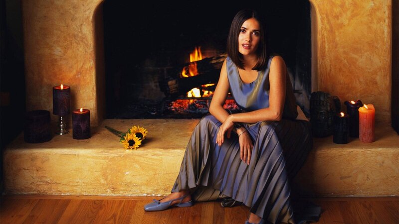 Woman Sitting by Fireplace — Blue, Serene