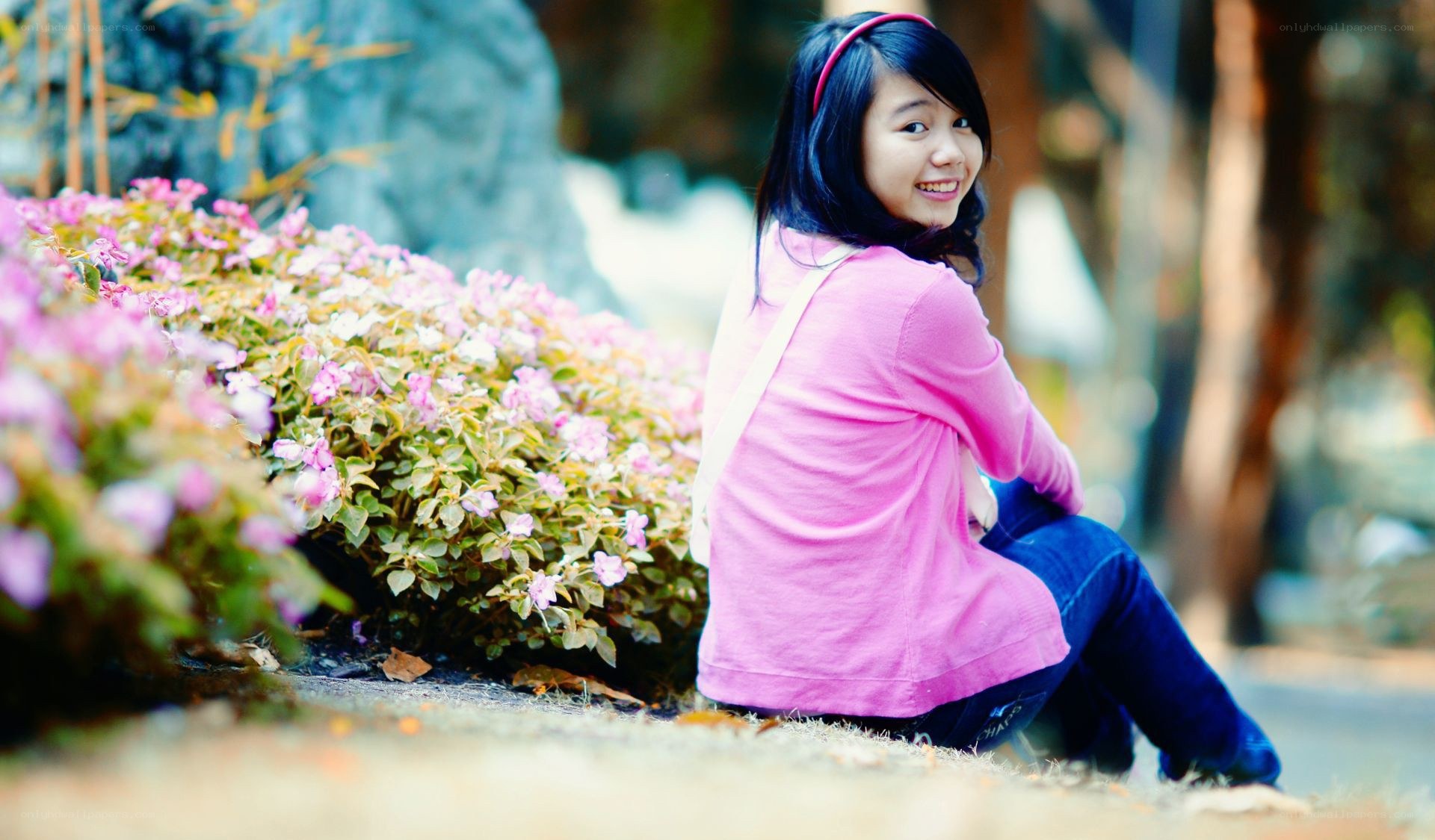 woman sitting by flowers