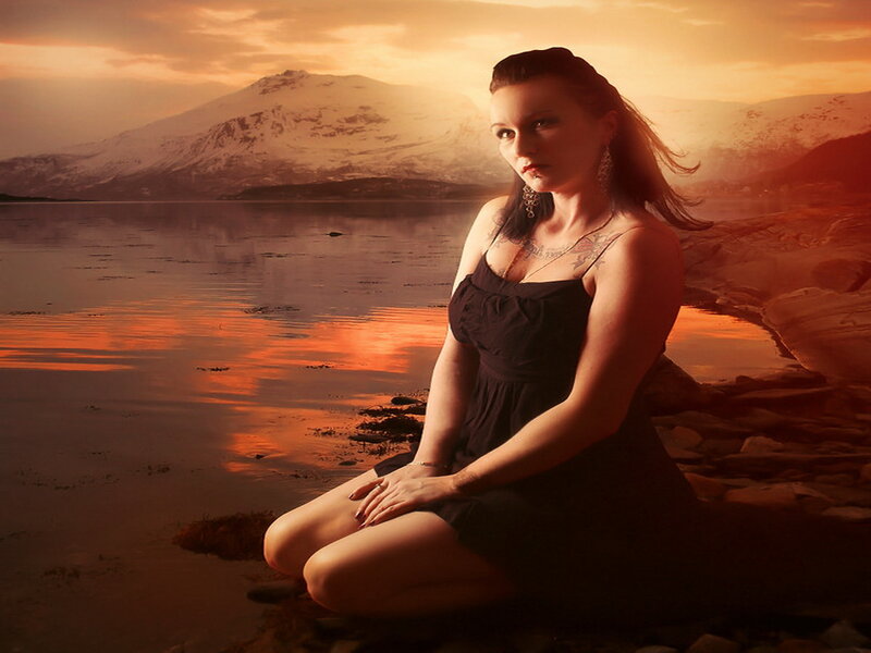 Woman Sitting by Lake — Orange