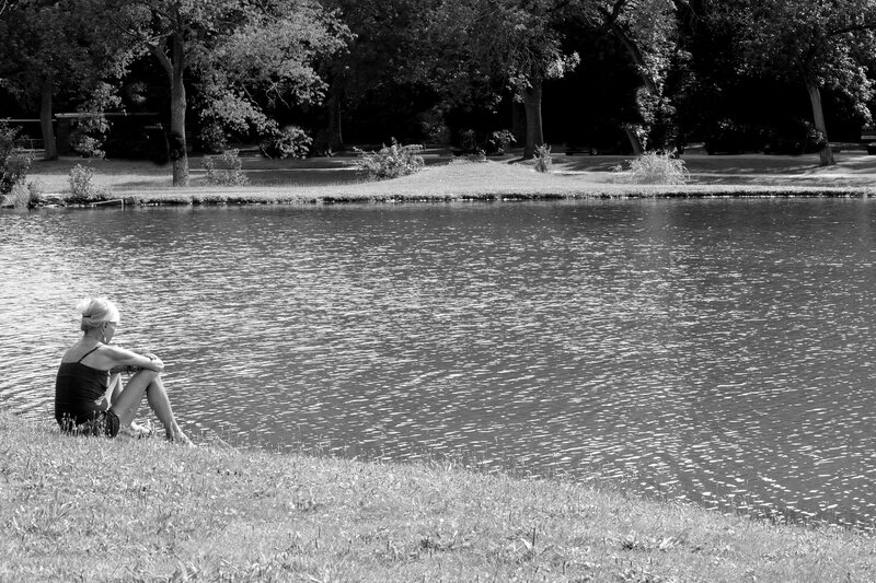Woman Sitting by Pond — Black