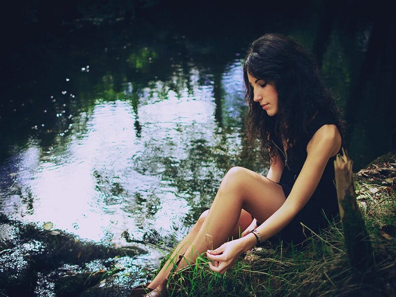 Woman Sitting by River — Green