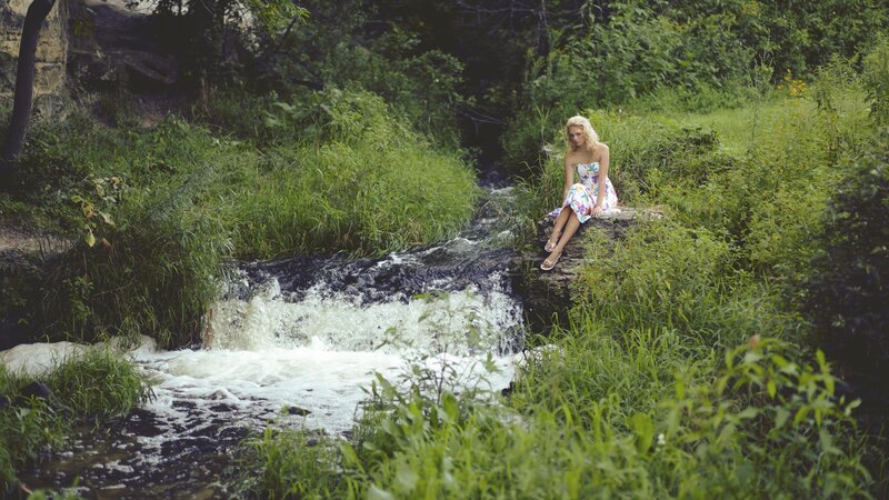 Woman Sitting by Stream — Green
