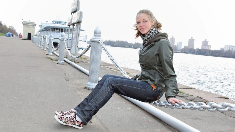 Woman sitting by the river