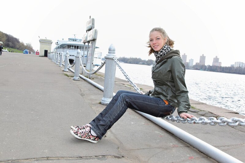 Woman sitting by the river