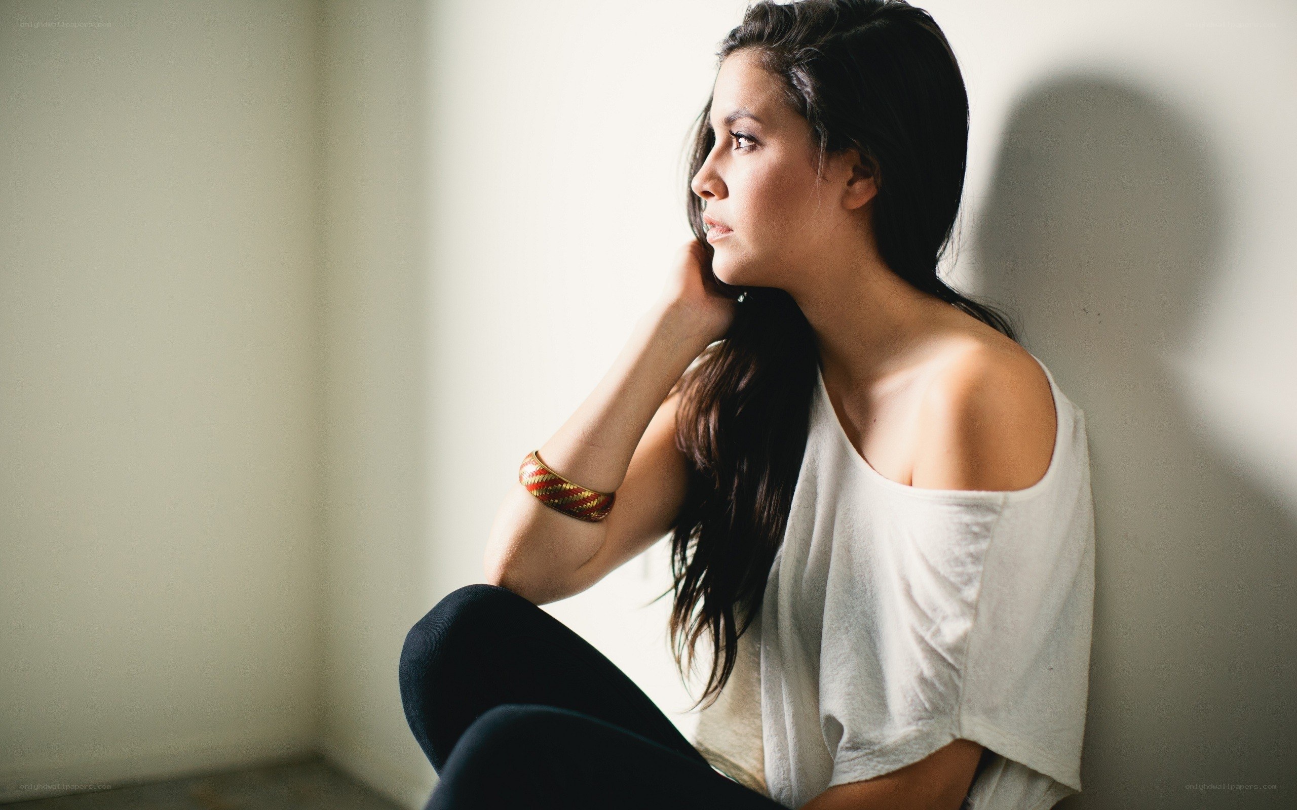 woman sitting by the wall