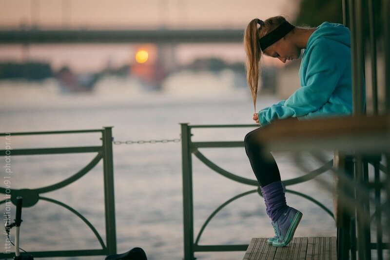 woman sitting by the water