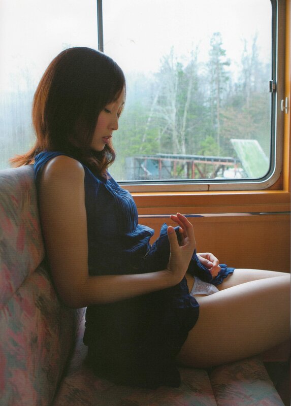 Woman sitting by train window
