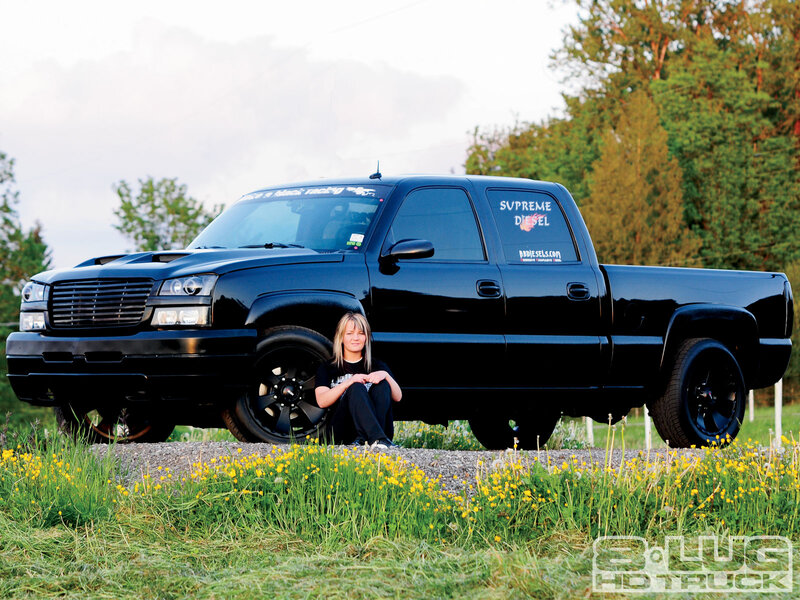 Woman Sitting by Truck