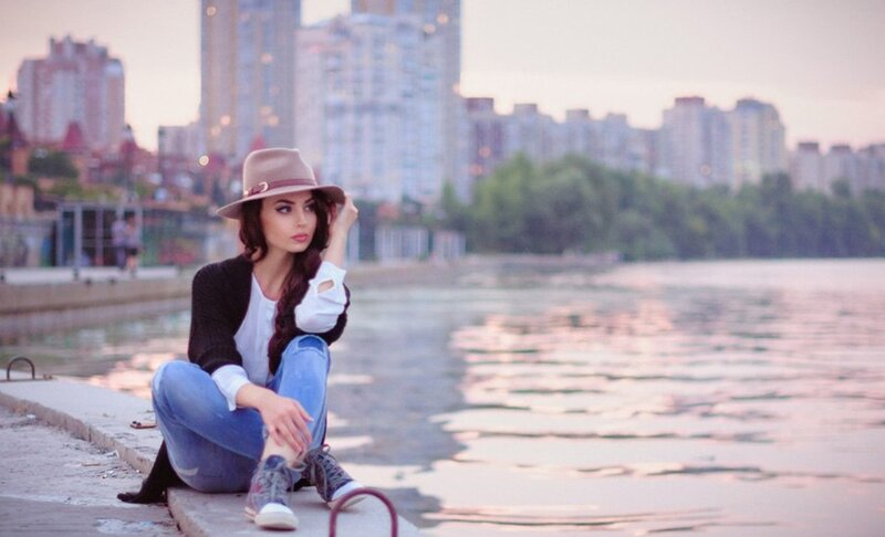 Woman Sitting by Water — Blue, Calm, Sunset